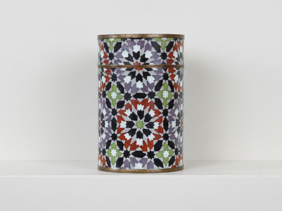 Decorative Cylindrical Metal Container with a Colorful Geometric Pattern